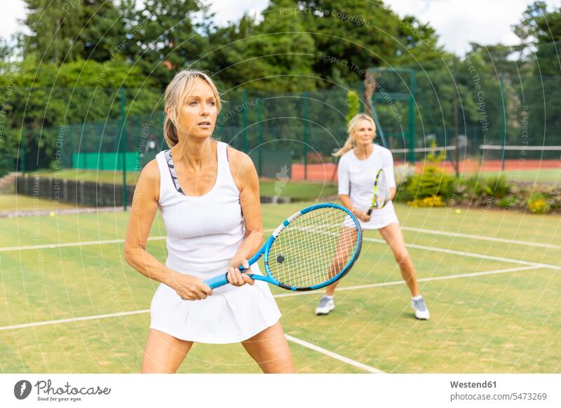 Mature women during a tennis match on grass court human human being human beings humans person persons caucasian appearance caucasian ethnicity european 2
