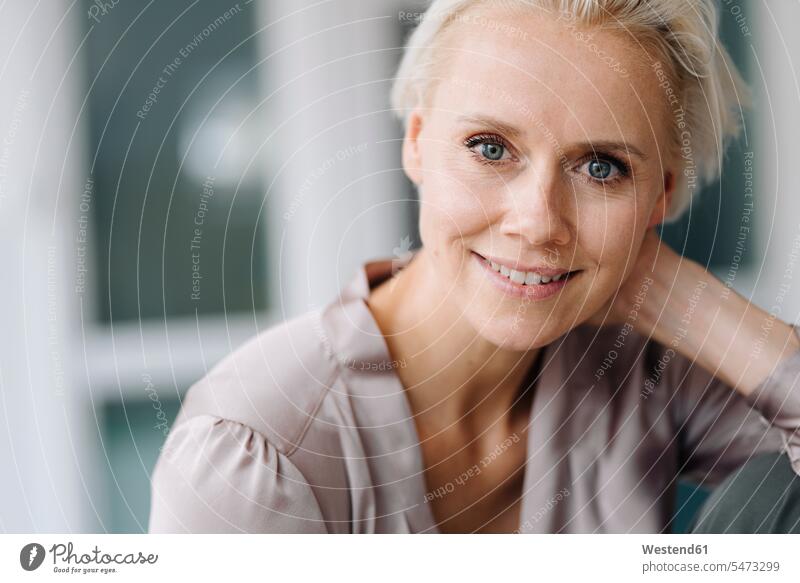 Close-up portrait of smiling businesswoman in office color image colour image Germany indoors indoor shot indoor shots interior interior view Interiors