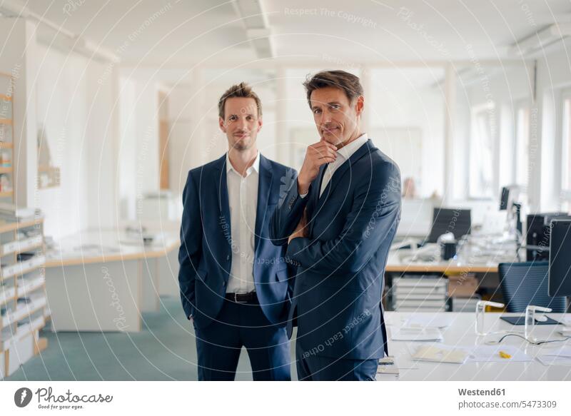 Portrait of two successful businessmen in their office Success offices office room office rooms executive Executives manager workplace work place place of work