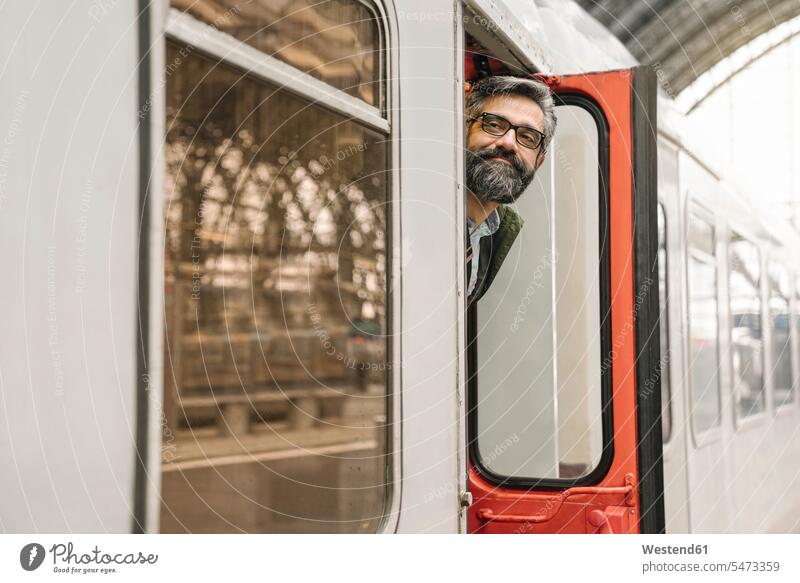 Man looking out of train business life business world business person businesspeople Business man Business men Businessmen transport railroad railroads Railways