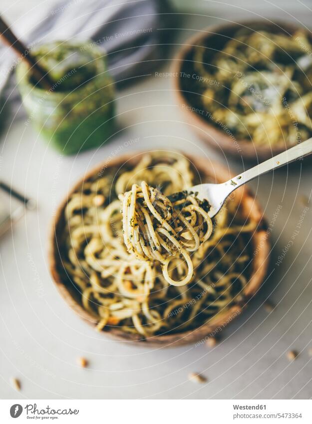 Spaghetti with pesto genovese on spoon, close-up Bowl Bowls pine nuts pignolias ready to eat ready-to-eat homemade home made home-made Pesto pesto Genovese