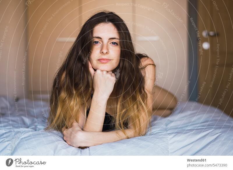 Portrait of young woman hair lying on bed portrait portraits laying down lie lying down beds females women Adults grown-ups grownups adult people persons