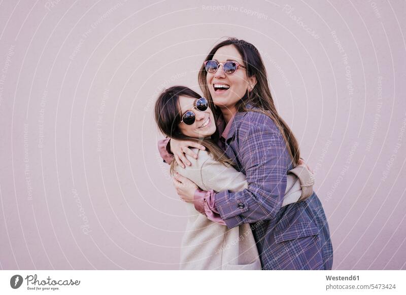 Portrait of two happy young women hugging each other human human being human beings humans person persons caucasian appearance caucasian ethnicity european 2