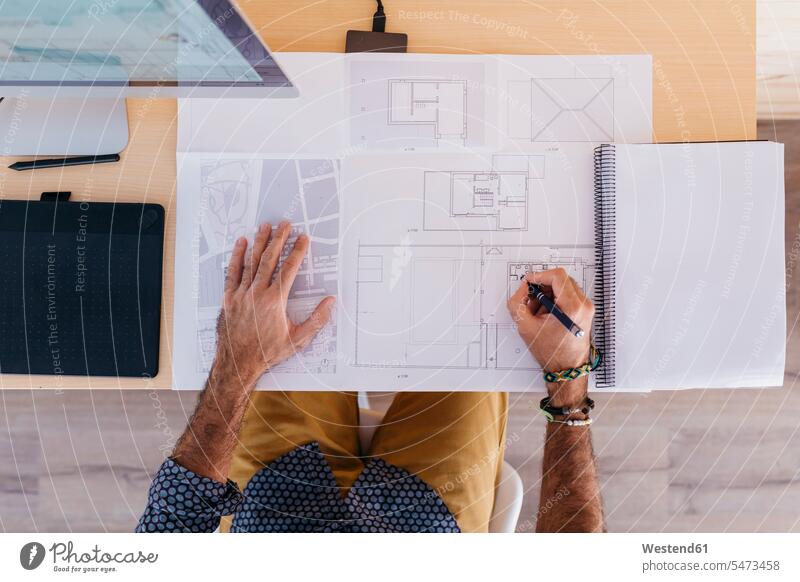 Close-up of architect working at home on floor plan At Work man men males floor plans ground plan ground plans Adults grown-ups grownups adult people persons