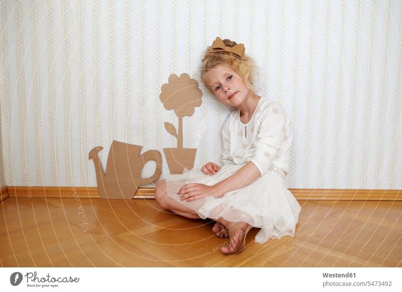 Portrait of girl playing with cardboard watering can and flower dresses wall paper wall papers wallpapers Seated sit Retro retro revival Retro Styled
