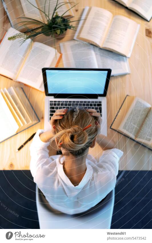 Tired woman with head in hands at home office color image colour image indoors indoor shot indoor shots interior interior view Interiors businesswoman