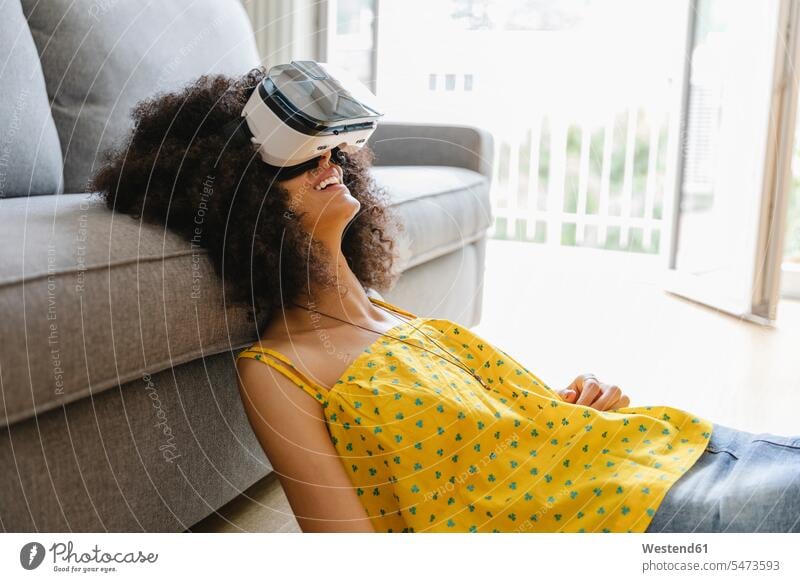 Young woman wearing virtual reality glasses human human being human beings humans person persons North African 1 one person only only one person adult grown-up
