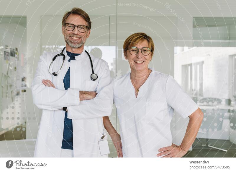 Portrait of confident doctor and assistant in medical practice Occupation Work job jobs profession professional occupation health healthcare