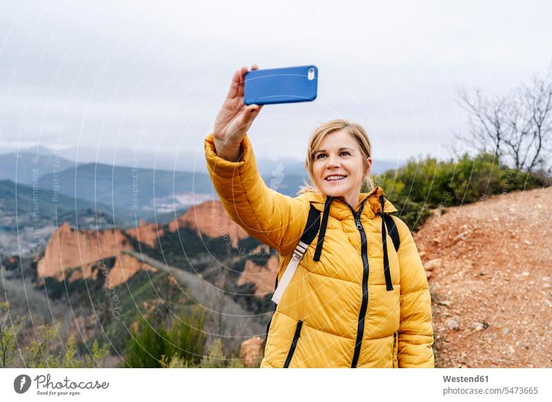 Female hiker taking a selfie at Mina de Oro Romana, Las Medulas, Castile and Leon, Spain human human being human beings humans person persons