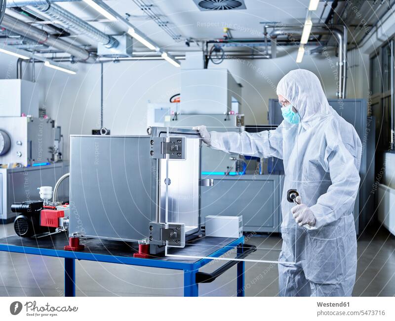 Chemist working in industrial laboratory clean room At Work Protective Suit chemist Chemical Laboratory sterile clothing hygiene natural scientist science