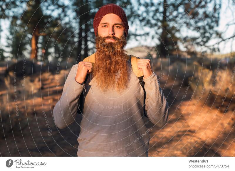 USA, North California, portrait of bearded man in a forest near Lassen Volcanic National Park portraits woods forests men males people persons human being