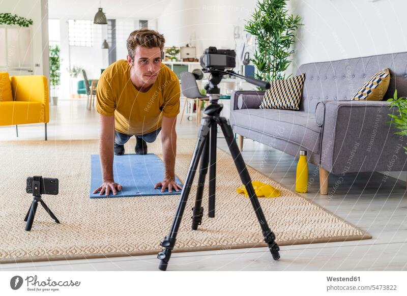 Personal trainer live stream fitness exercise at home color image colour image indoors indoor shot indoor shots interior interior view Interiors day