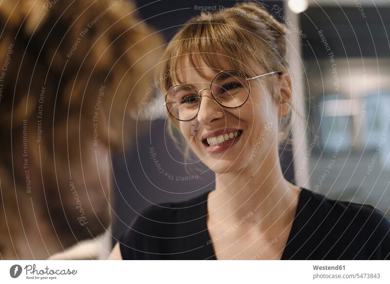 Portrait of smiling businesswoman looking at businessman in offce colleague Occupation Work job jobs profession professional occupation business life