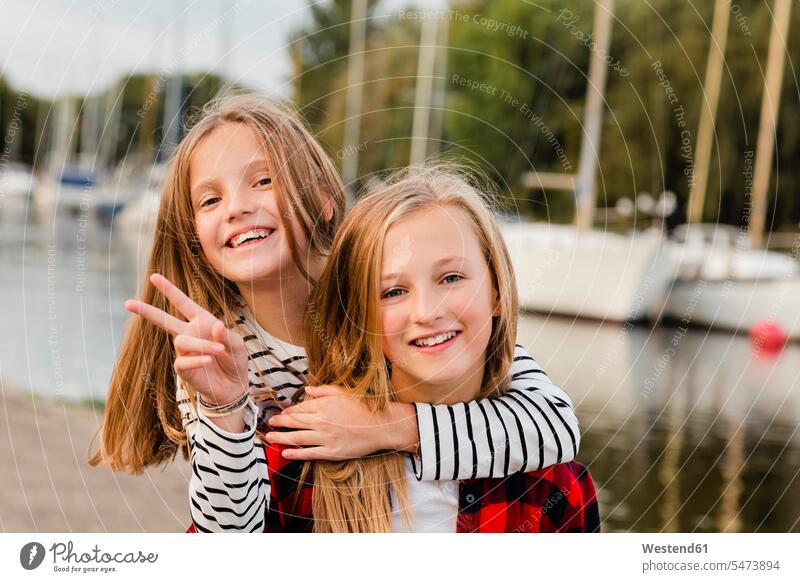 Portait of two happy girls happiness portrait portraits females child children kid kids people persons human being humans human beings female friends