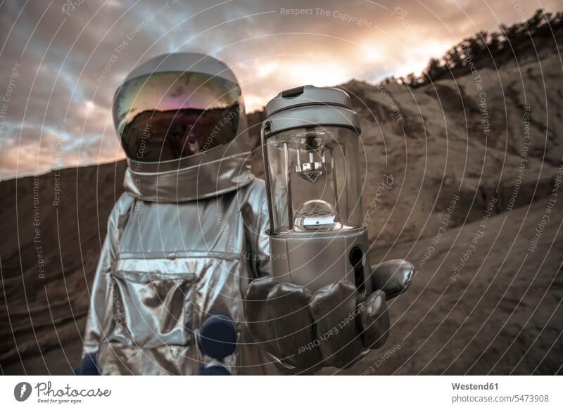 Spaceman exploring nameless planet, holding analyzer astronaut astronauts analyser unknown planets Exploration explore spaceman spacemen astronautics