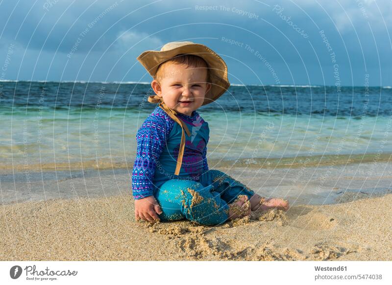 Panama, San Blas Islands, Achutupo, baby playing in the sand on beach swimwear swim wear sun protection beaches UV protection infants nurselings babies smiling