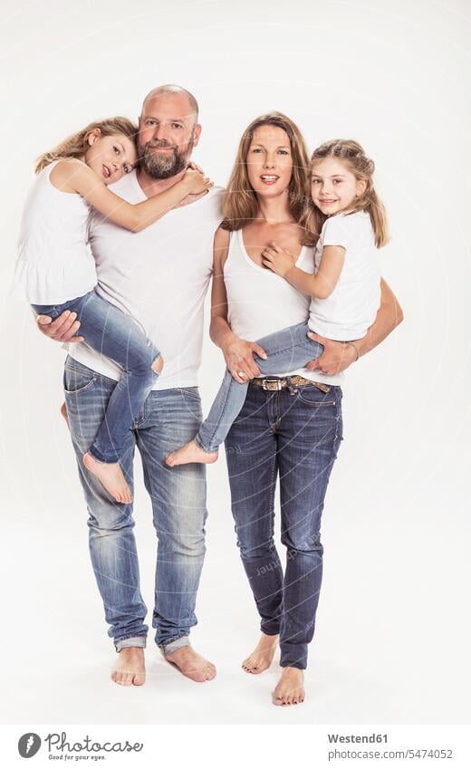 Portrait of family with two daughters in front of white background pants Trouser Denim Jeans smile closeness propinquity clear fair light colour colours