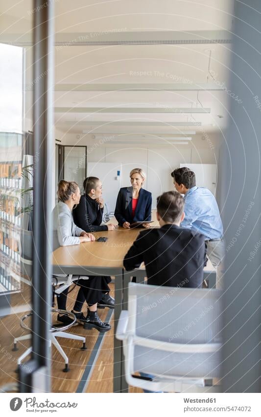 Businesswoman leading a meeting in office human human being human beings humans person persons caucasian appearance caucasian ethnicity european Group