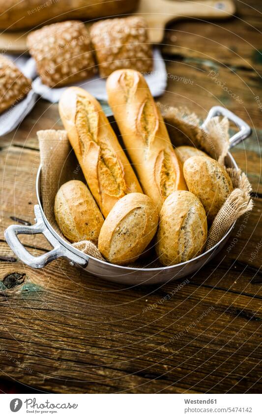 Two baguettes and four rye bread rolls in a pot nobody delicacy specialty specialties Choice choose choosing choices White Bread White Breads wheat bread