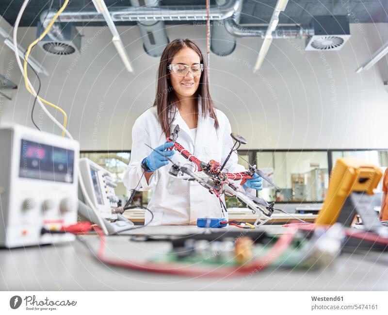 Female technician working in research laboratory, developing drone female researcher drones engineer female engineer engineers female engineers occupation