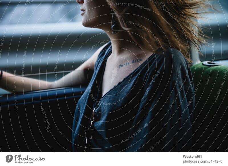 Close-up of young woman in a car window windows automobile Auto cars motorcars Automobiles females women motor vehicle road vehicle road vehicles motor vehicles