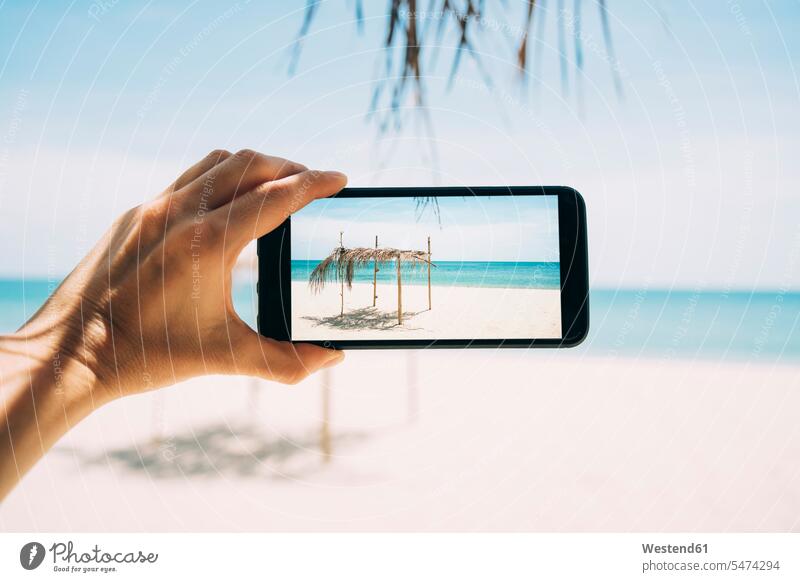 Thailand, Koh Lanta, Virgin Paradise Beach, woman taking photo with cell phone Smartphone iPhone Smartphones photographing beach beaches females women