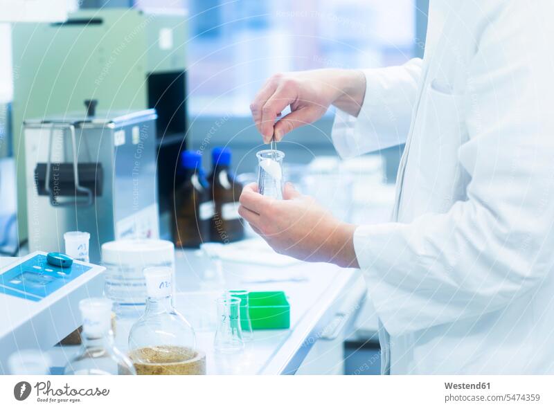Lab technician experimenting in lab laboratory workplace work place place of work effort attempt hand human hand hands human hands female researcher