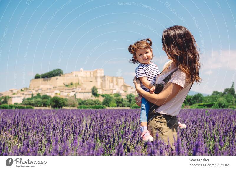 France, Grignan, portrait of happy baby girl together with her mother in lavender field mommy mothers ma mummy mama happiness portraits baby girls female