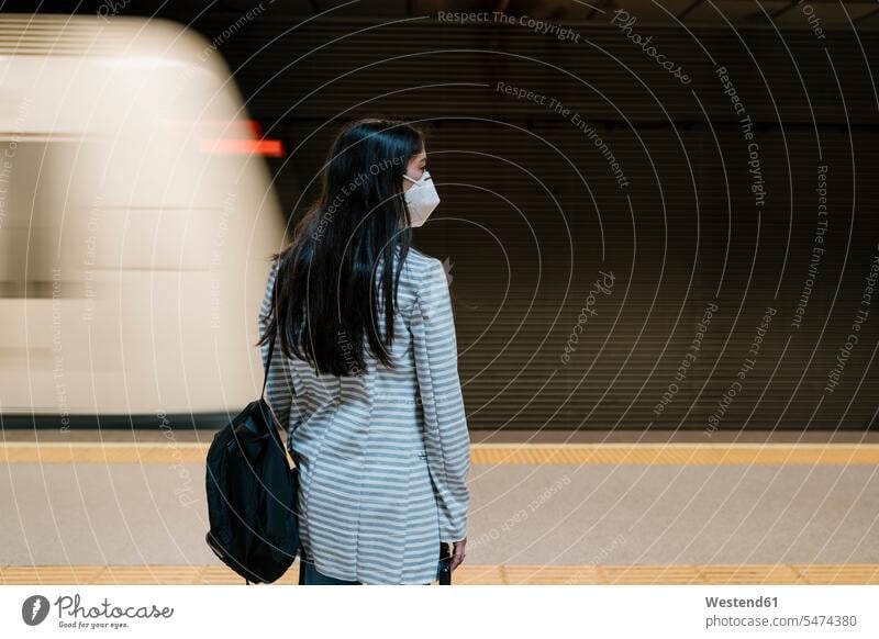 Female passenger waiting for her train at metro station during pandemic protective mask protective masks Protective Face Mask Protective Face Masks Flu Mask