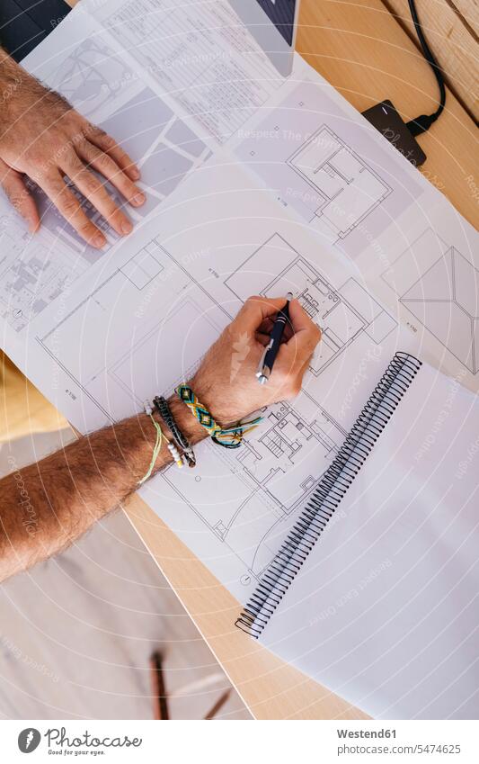 Close-up of architect working at home on floor plan man men males At Work floor plans ground plan ground plans Adults grown-ups grownups adult people persons