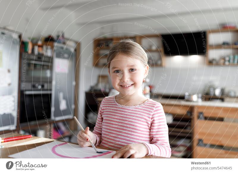 Portrait of girl painting at home images picture pictures drawings Child's Drawings children's drawing Childs Drawing Tables brushes smile Painting - Activity