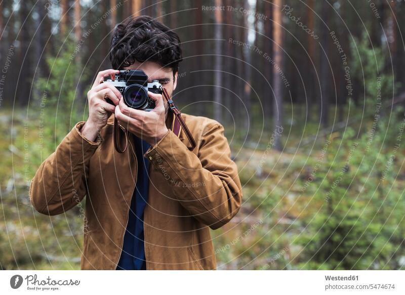 Finland, Lapland, man taking picture in rural landscape landscapes scenery terrain men males photographing Adults grown-ups grownups adult people persons