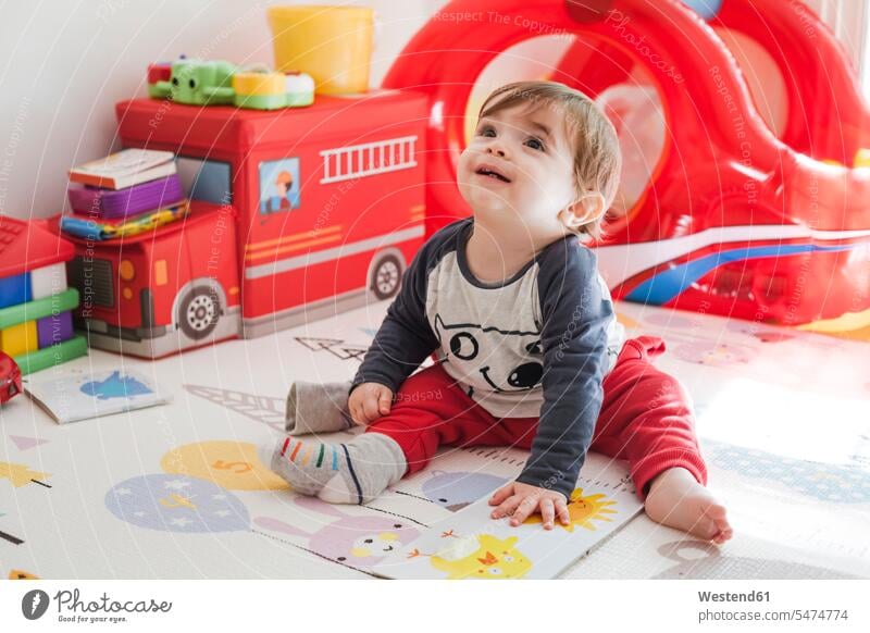 Portrait of baby boy sitting on the floor at home looking up human human being human beings humans person persons 1 one person only only one person babies