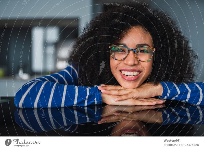 Portrait of happy young woman wearing glasses specs Eye Glasses spectacles Eyeglasses portrait portraits females women happiness Adults grown-ups grownups adult