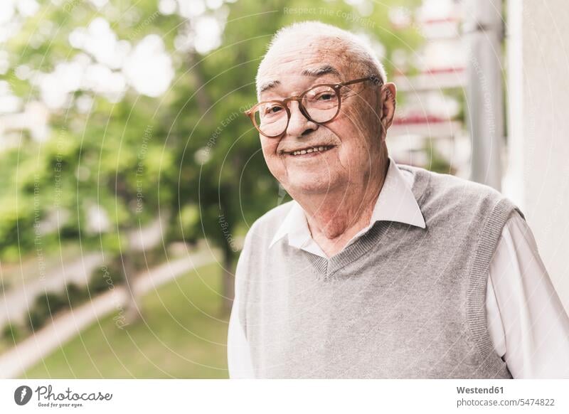 Portrait of smiling senior man wearing glasses human human being human beings humans person persons celibate celibates singles solitary people solitary person