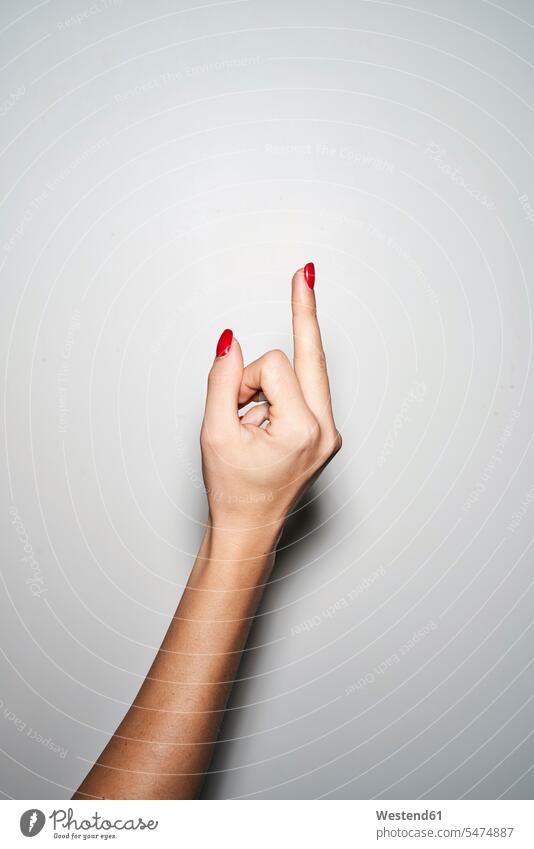 Close-up of woman giving the finger give the finger females women middle finger Adults grown-ups grownups adult people persons human being humans human beings
