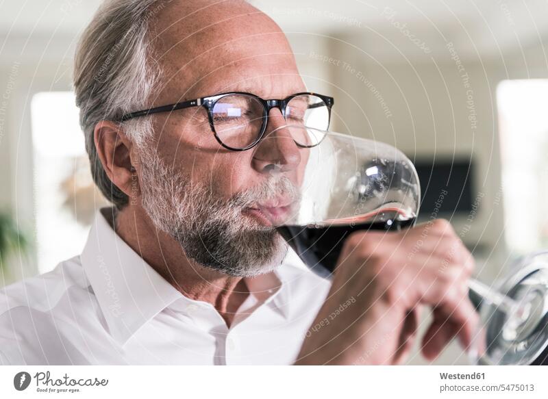 Portrait of mature man drinking glass of red wine men males Red Wine Red Wines Adults grown-ups grownups adult people persons human being humans human beings