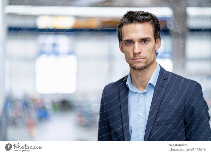 Portrait of confident businessman in a factory confidence factories Businessman Business man Businessmen Business men portrait portraits business people