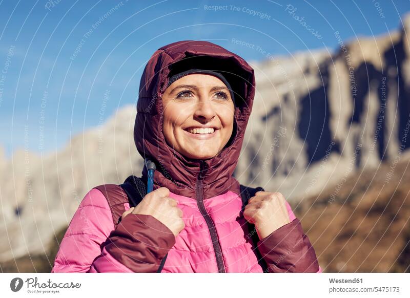 Portrait of confident young woman hiking in the mountains females women confidence happiness happy hike portrait portraits Adults grown-ups grownups adult