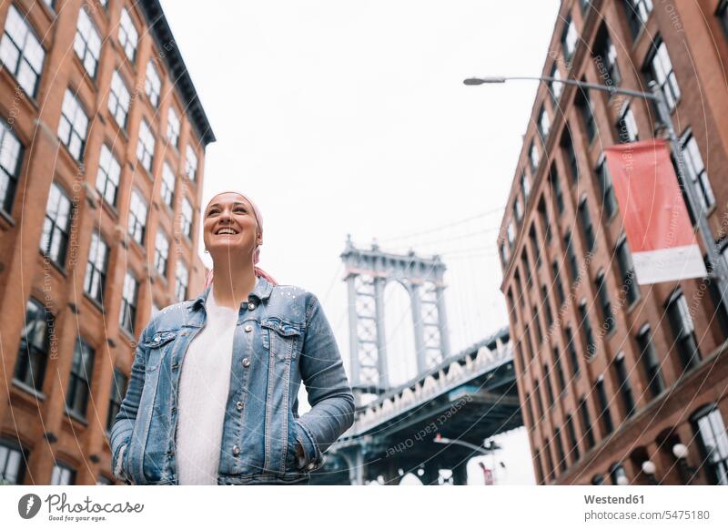 Smiling woman with cancer bandana at Manhattan Bridge in New York, USA funny having fun Amusement enjoy enjoying pleasure Emotions Feeling Feelings Sentiment