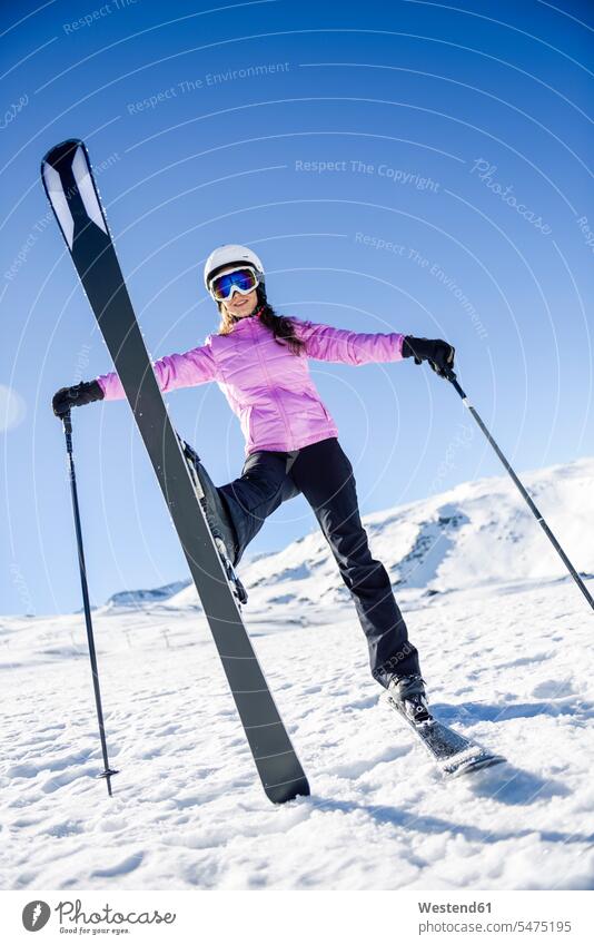 Happy woman in snow-covered landscape in Sierra Nevada, Andalusia, Spain Province of Granada skiing holiday skiing vacation Ski Area ski-region skiing region