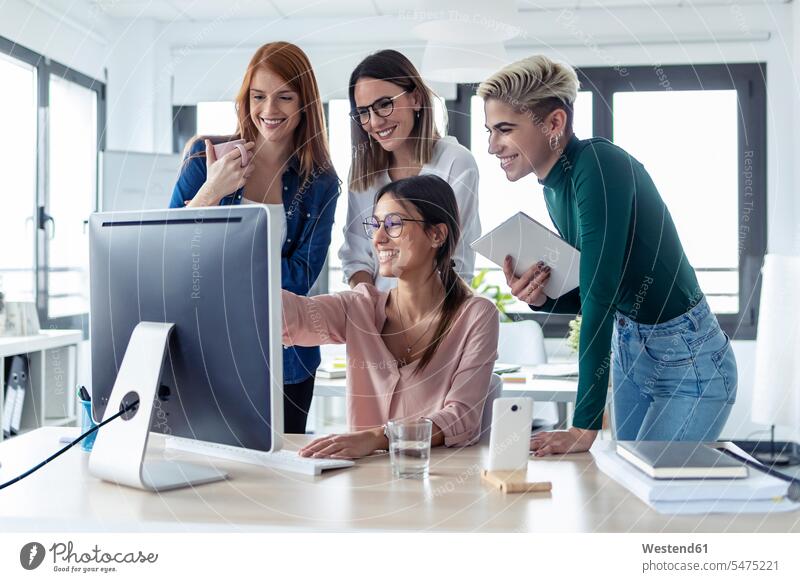 Five businesswomen using pc in an office Occupation Work job jobs profession professional occupation business life business world business person businesspeople