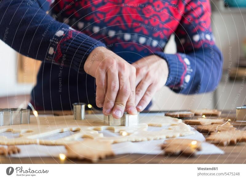 Making christmas cookies with mold caucasian caucasian ethnicity caucasian appearance european Kitchen Table Kitchen Tables baking bake Christmas Sweater