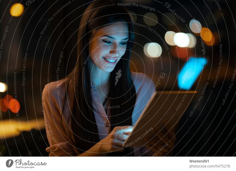 Portrait of smiling young woman using digital tablet in office human human being human beings humans person persons caucasian appearance caucasian ethnicity