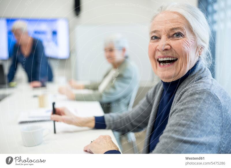 Happy senior woman attending seniors education course human human being human beings humans person persons caucasian appearance caucasian ethnicity european