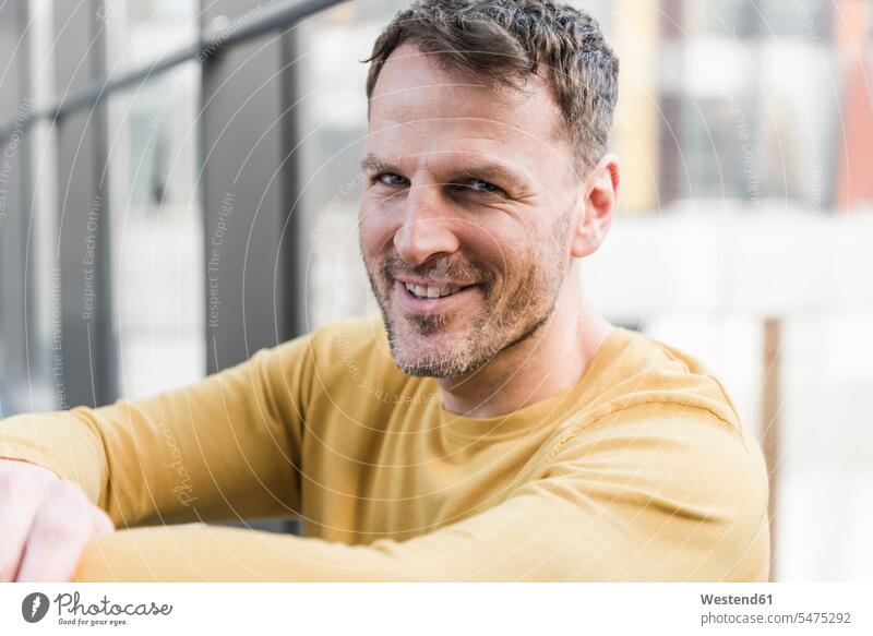 Portrait of smiling casual businessman smile confidence confident portrait portraits Businessman Business man Businessmen Business men business people