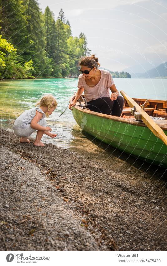 Austria, Carinthia, Weissensee, mother in rowing boat with daughter at the lakeside boats Lakeshore Lake Shore mommy mothers ma mummy mama daughters rowboat