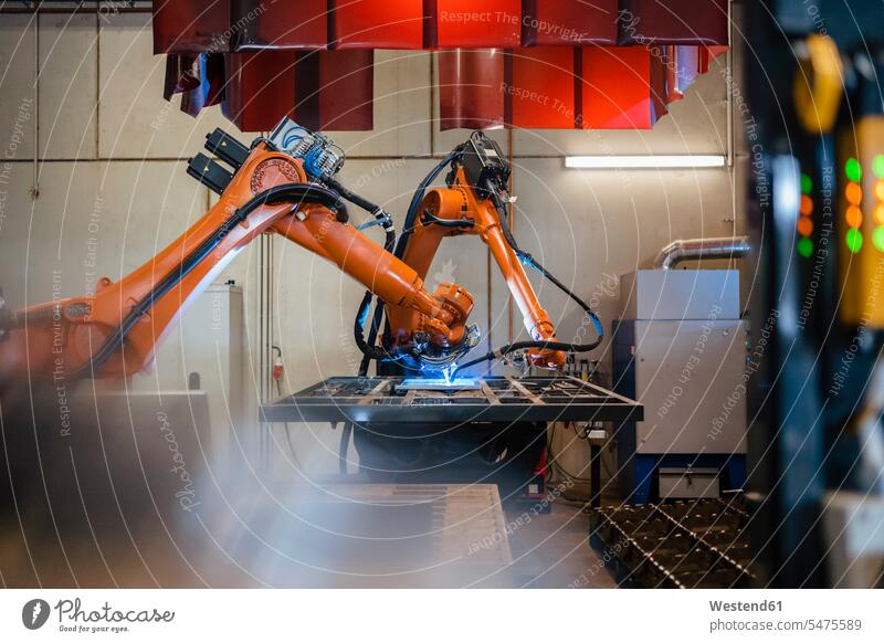 Industrial robotic arms welding in factory color image colour image indoors indoor shot indoor shots interior interior view Interiors Automated automatized