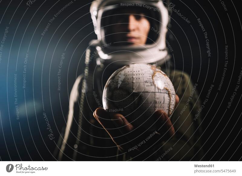 Man posing dressed as an astronaut in skyrocket elevator human human being human beings humans person persons braver bravers hero space travel spacemen