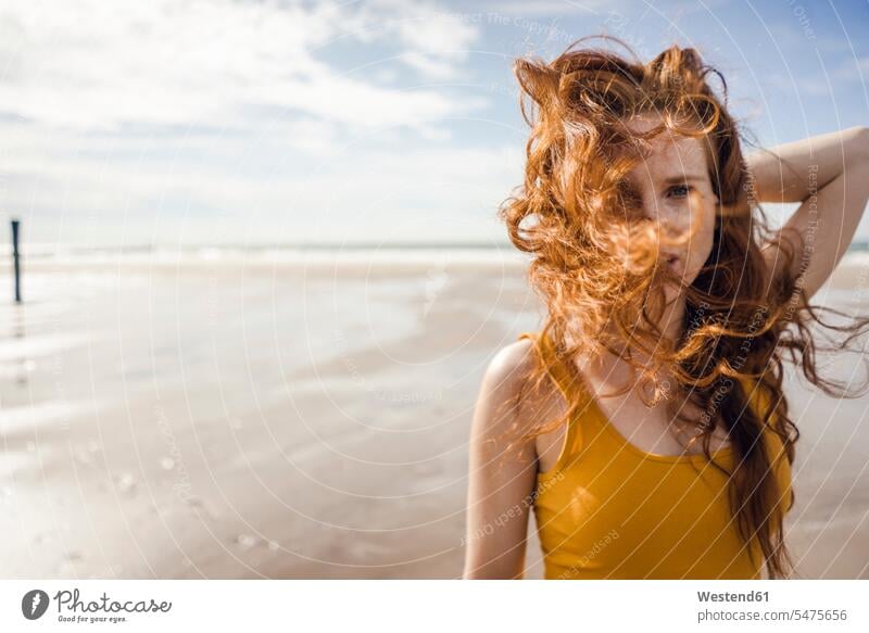 Portrait of a redheaded woman on the beach summer summer time summery summertime copy space independence independent Wellbeing Well-Being Well Being